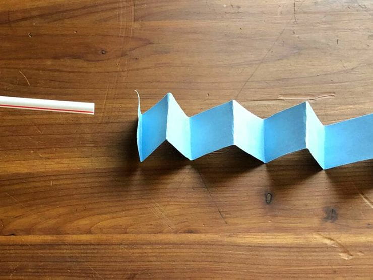 A stick and folded paper for arts and crafts at home 