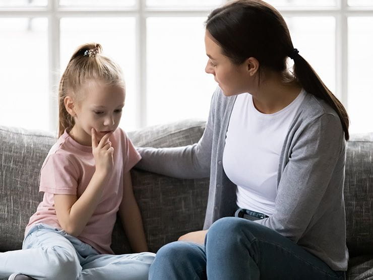 mother explaining a difficult topic to her daughter