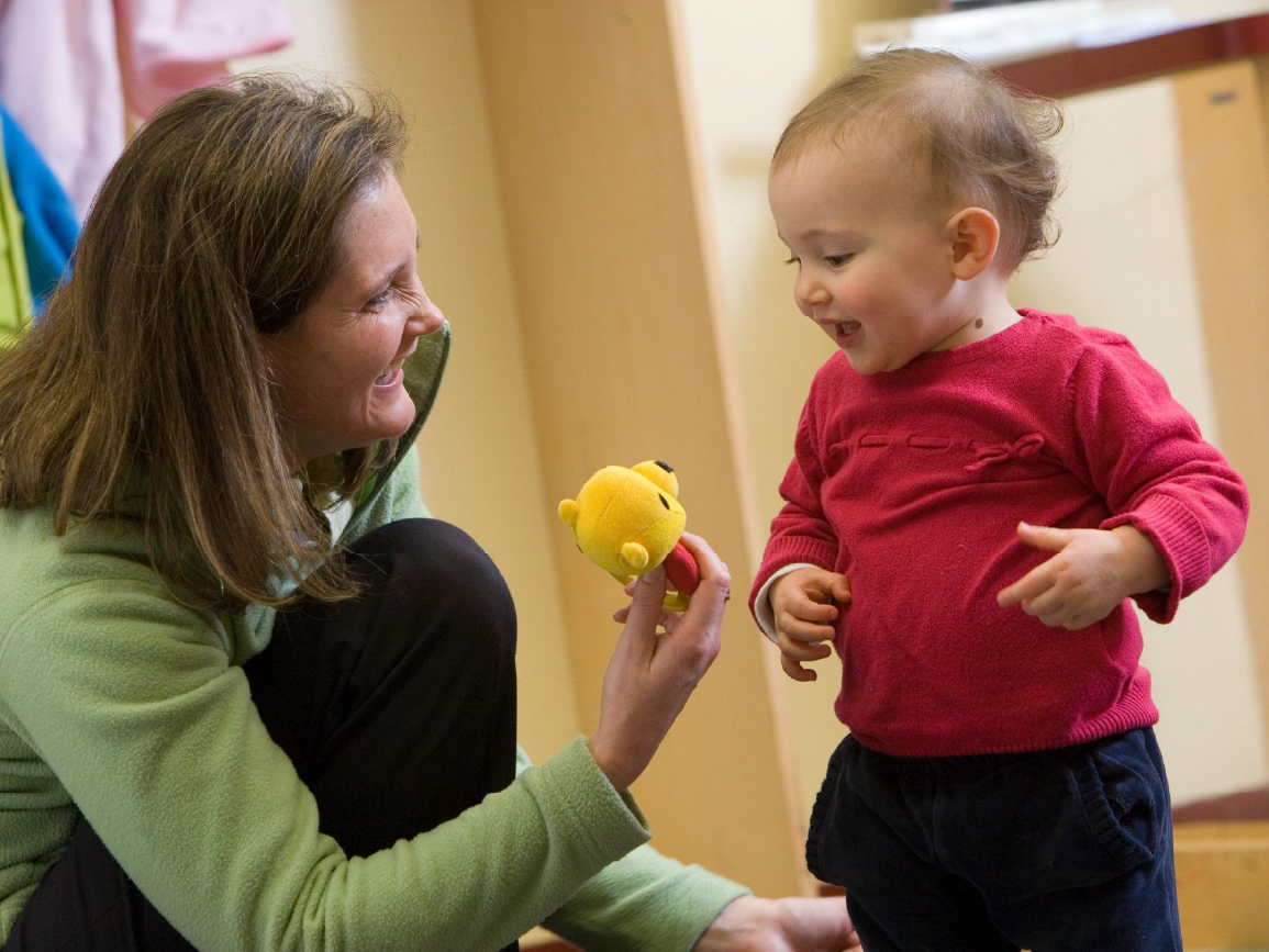 Baby with woman at center