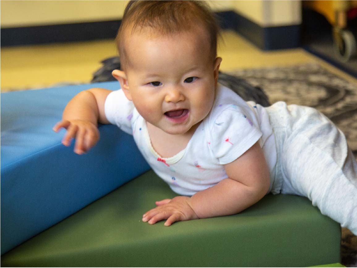 Baby playing at child care center