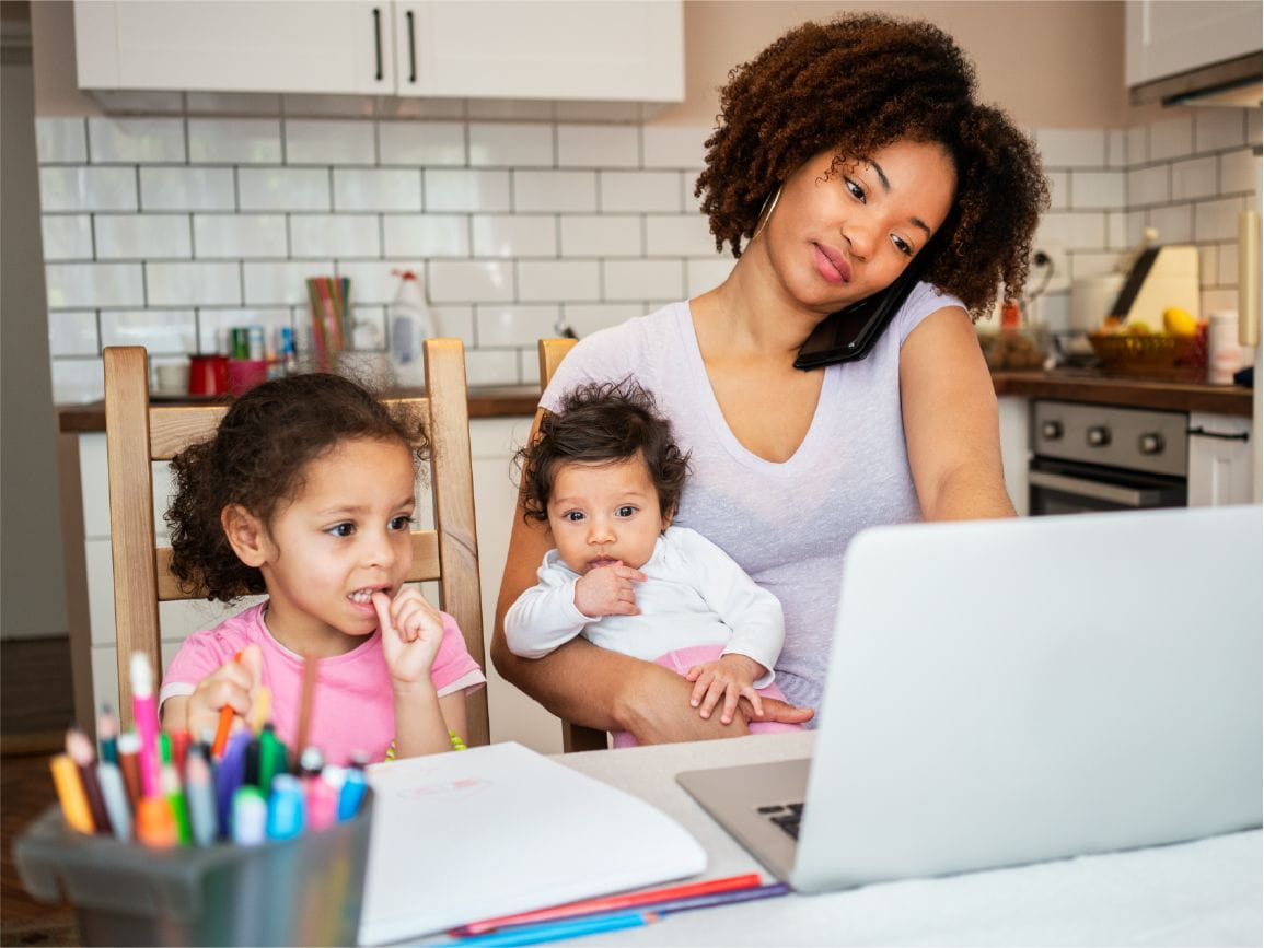 Mother on computer with children