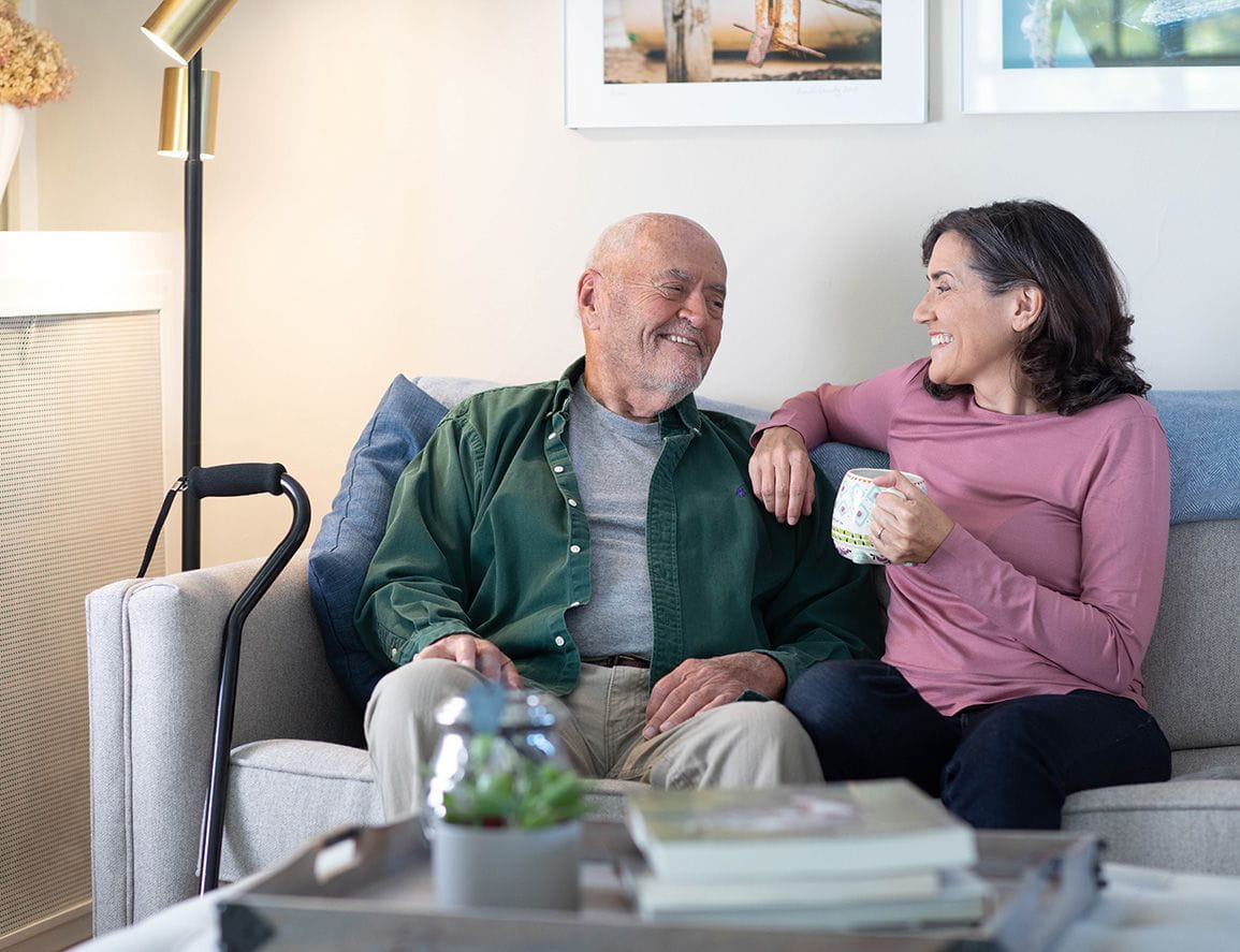 elderly man taking a break with his family caretaker