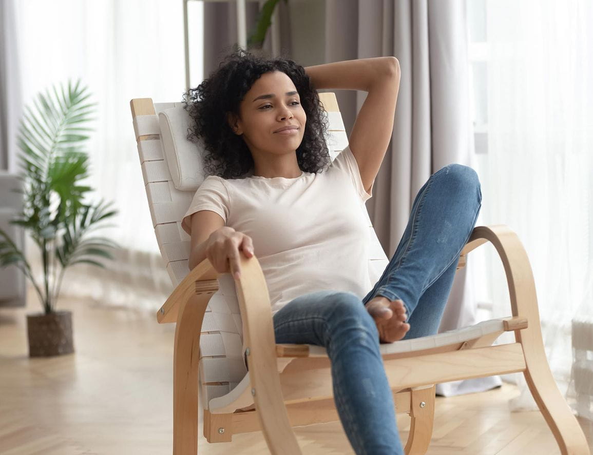 woman relaxing in her home office