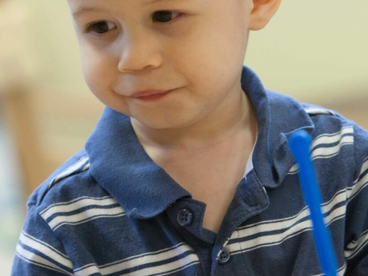 Toddler during arts and crafts at day care 