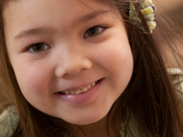 Preschooler smiling at Bright Horizons childcare center 