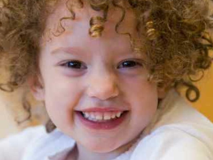 Toddler smiling at day care 