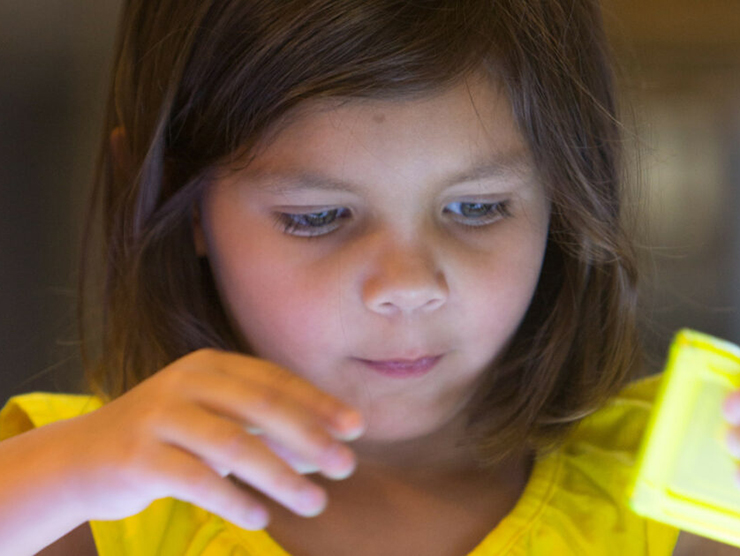 Child practicing her math skills at day care 