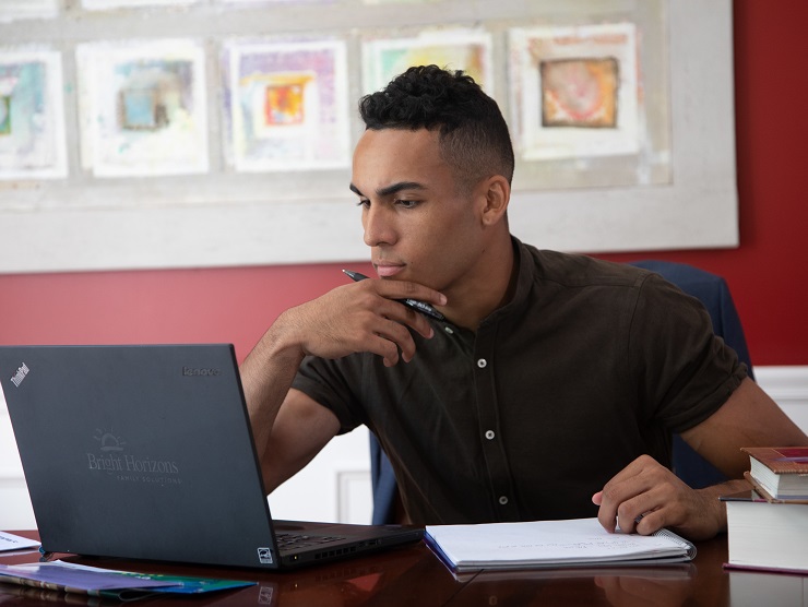 young man working on laptop