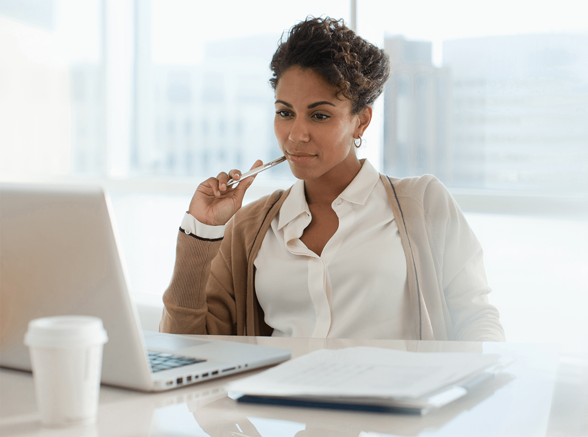 working woman at her office desk laptop