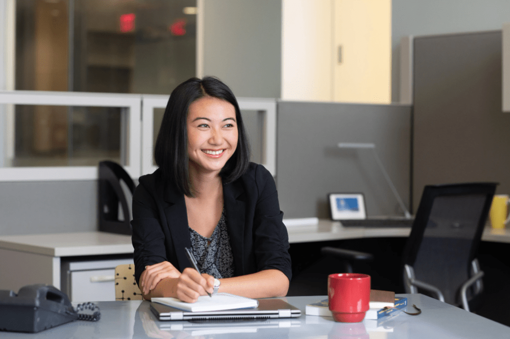 girl smiling at desk bright horizons newsletter