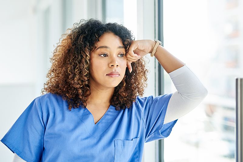 Stressed out nurse looking forlorn