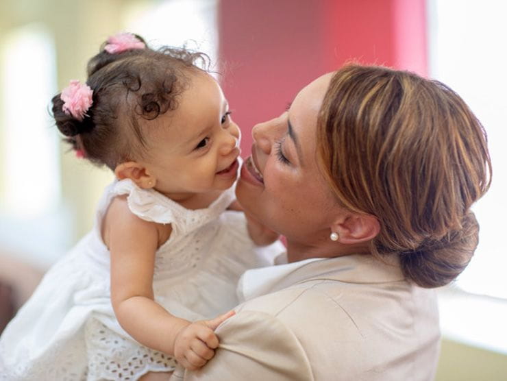 Scarlett holding her daughter