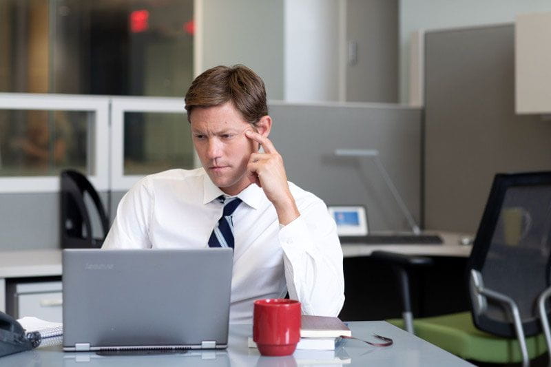 Male employee working on his computer