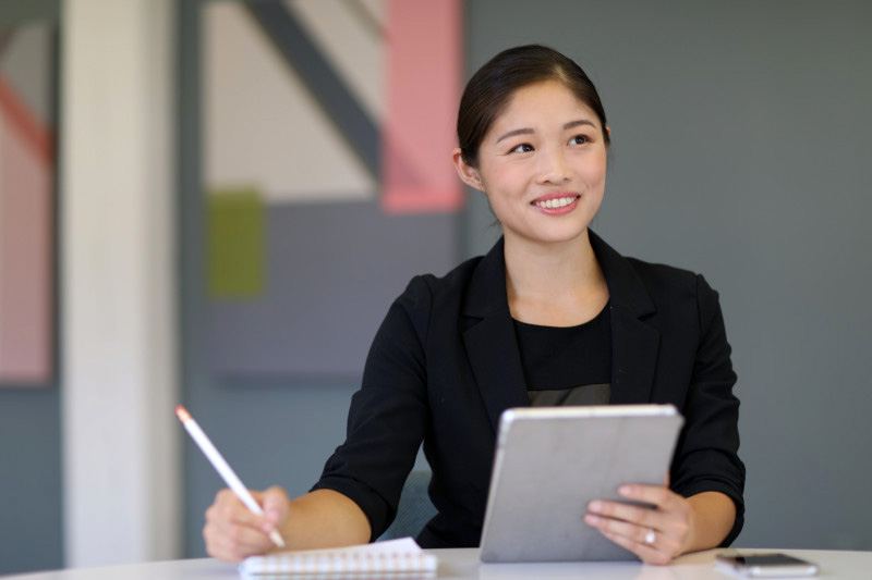 Female employee at work at a Glassdoor Top 100 company