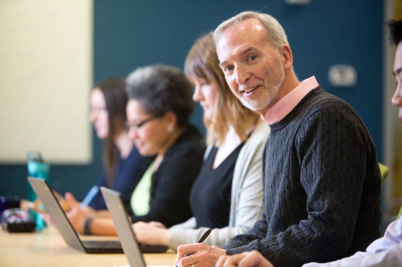 Happy, engaged employee in a meeting