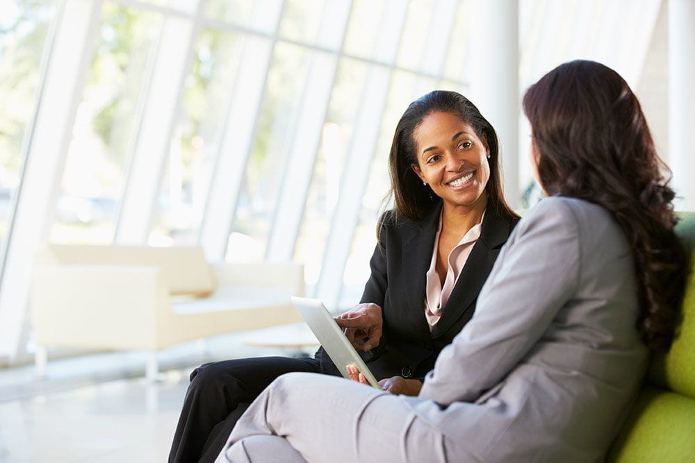 two professional women talking