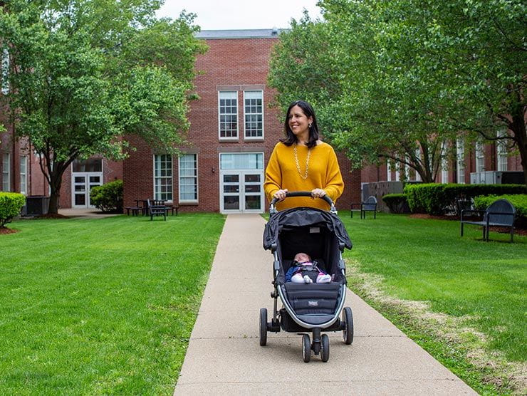 Mother walking her baby in the park