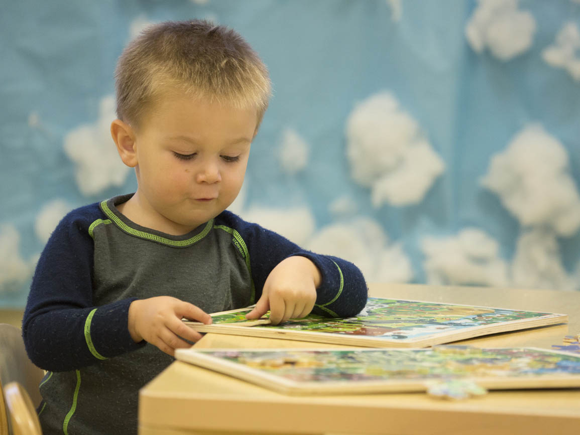 A child playing with a puzzle