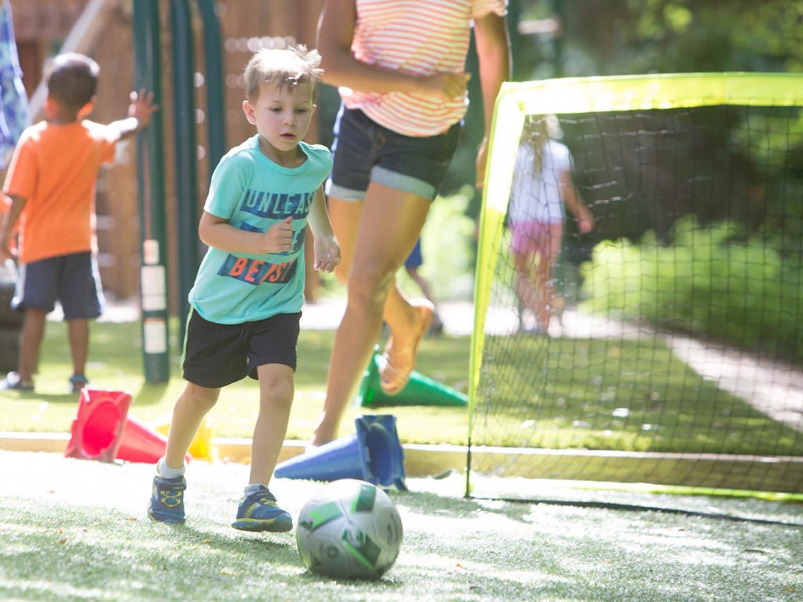 A boy playing with a soccer ball