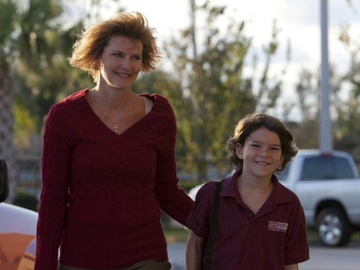 Mom and tween girl walking to school