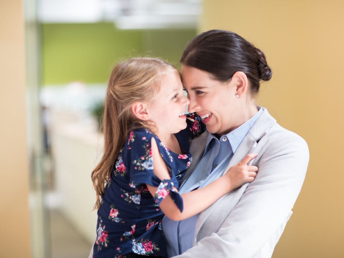 Woman holding child, daily separation