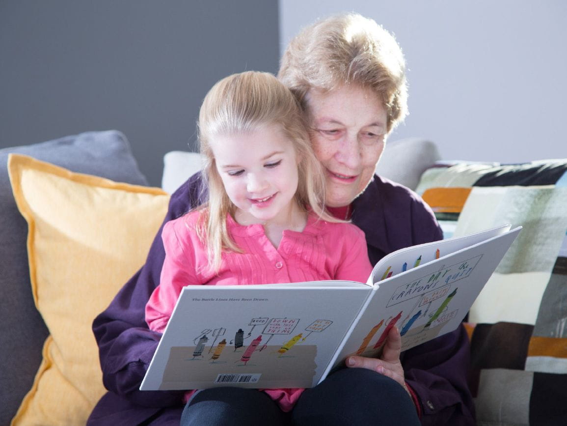 Grandmother reading to child