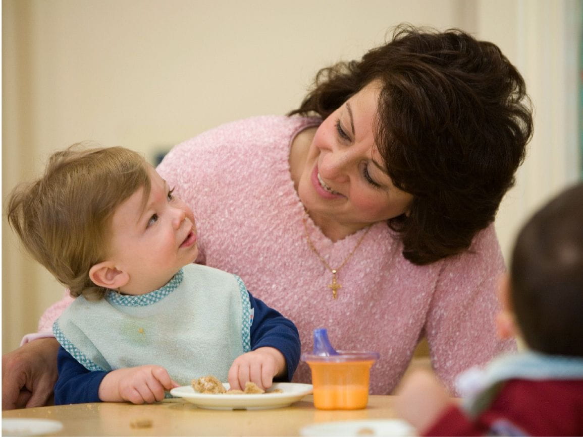 Woman with child having snack