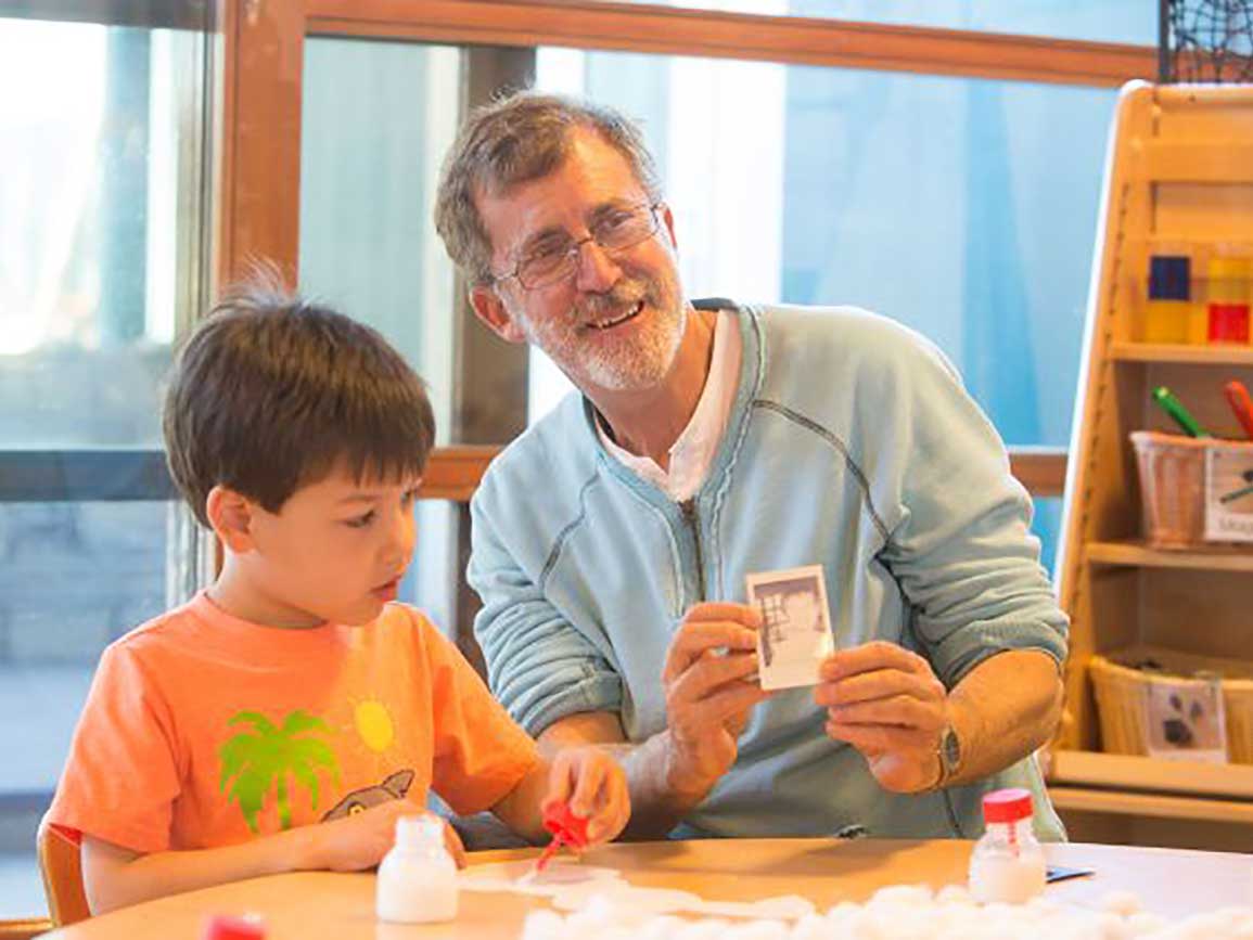 Preschool boy and dad making art together