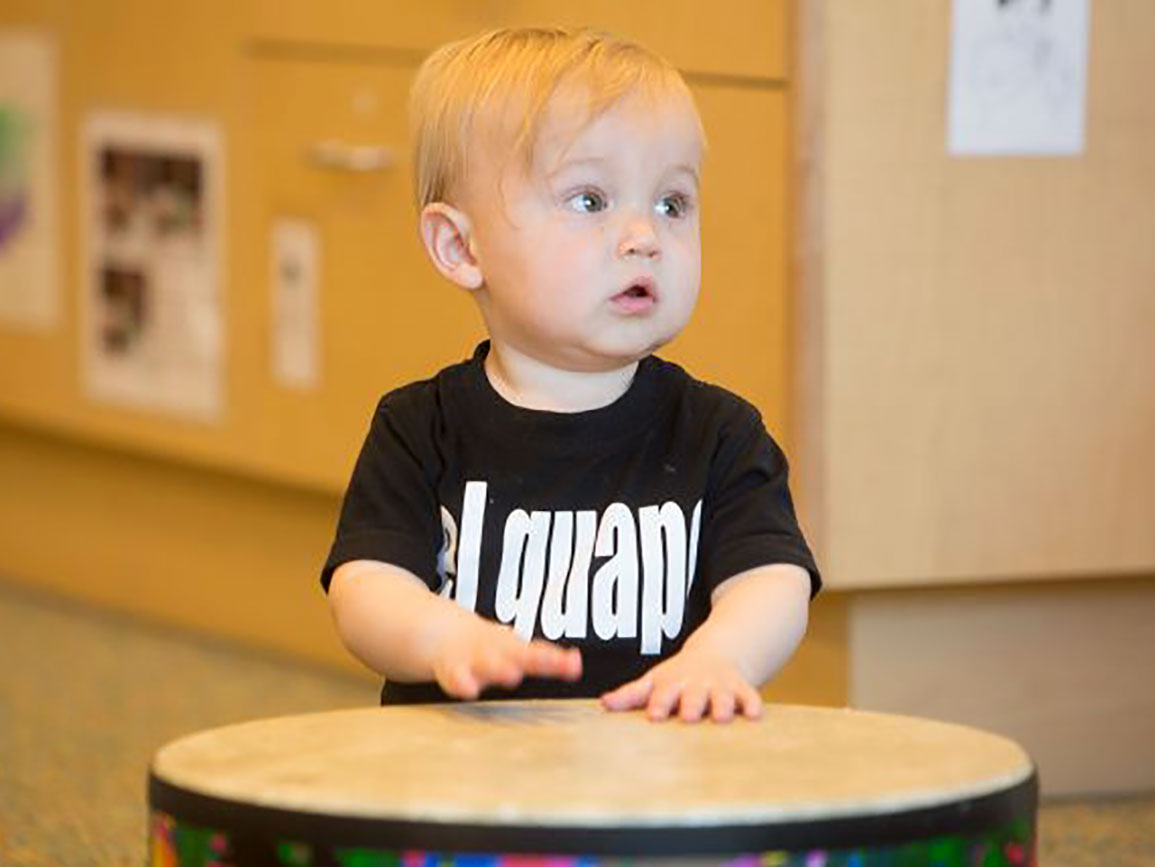 Baby boy playing music