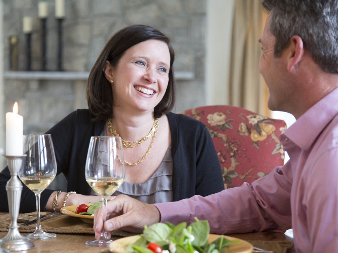 A happy husband and wife at dinner