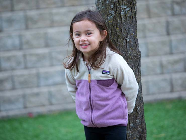 Preschool girl playing outside to de-stress