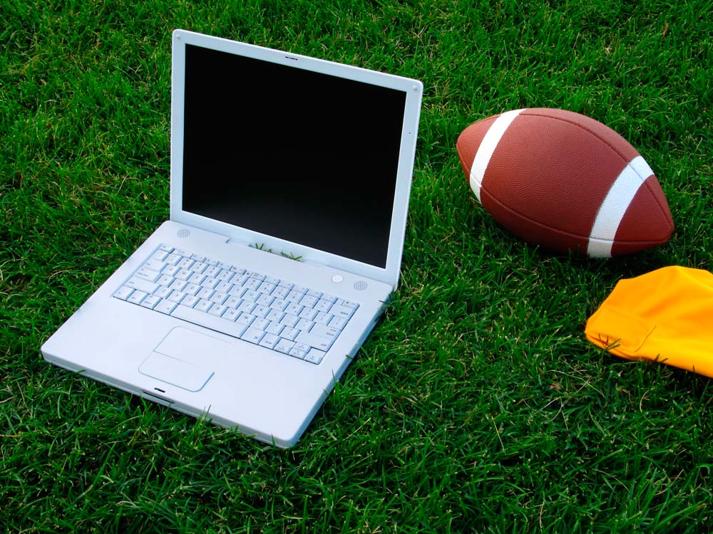 Student balancing college work and fantasy football