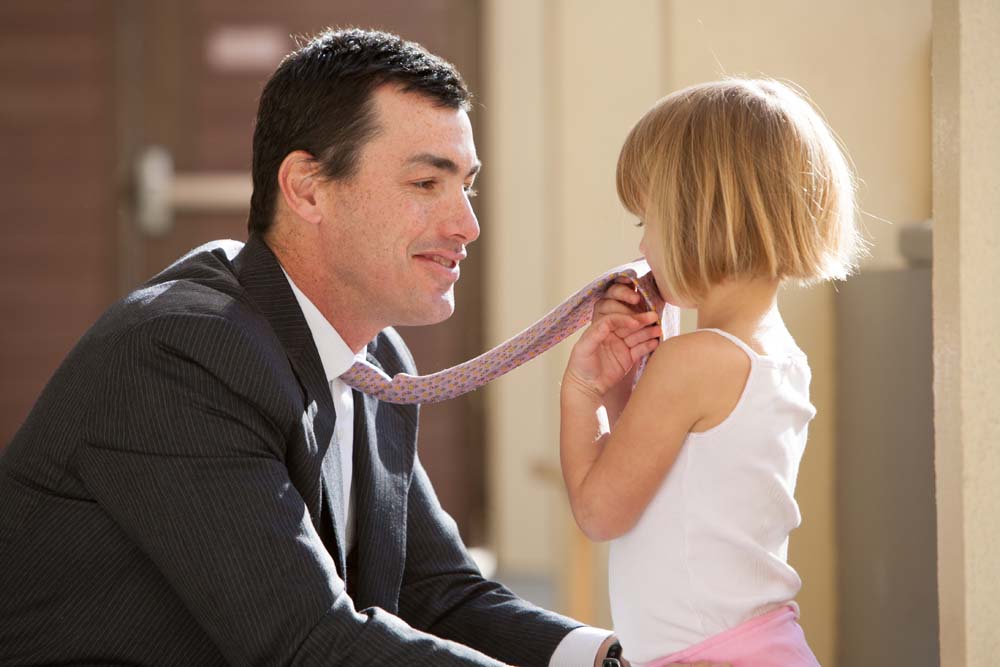 Man balancing work and family life